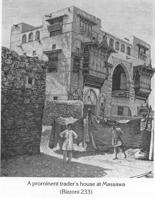 A multi-story stone building with ornate wooden balconies in Massawa, with two figures standing in the foreground.
