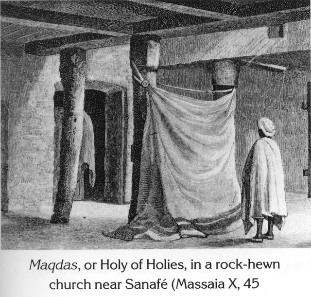 An interior view of the Maqdas (Holy of Holies) in a rock-hewn church, with a person standing before a curtain.