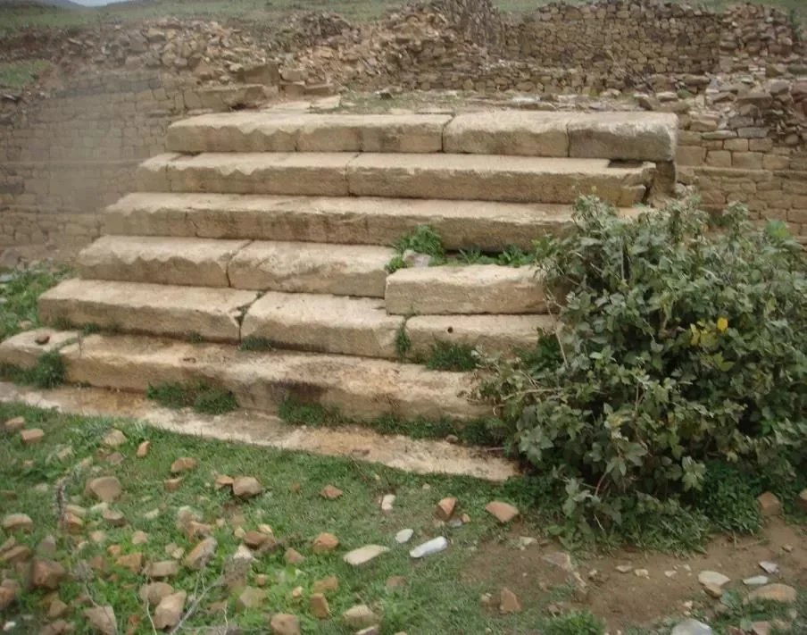 Stairs into the central building at Structure A. Source