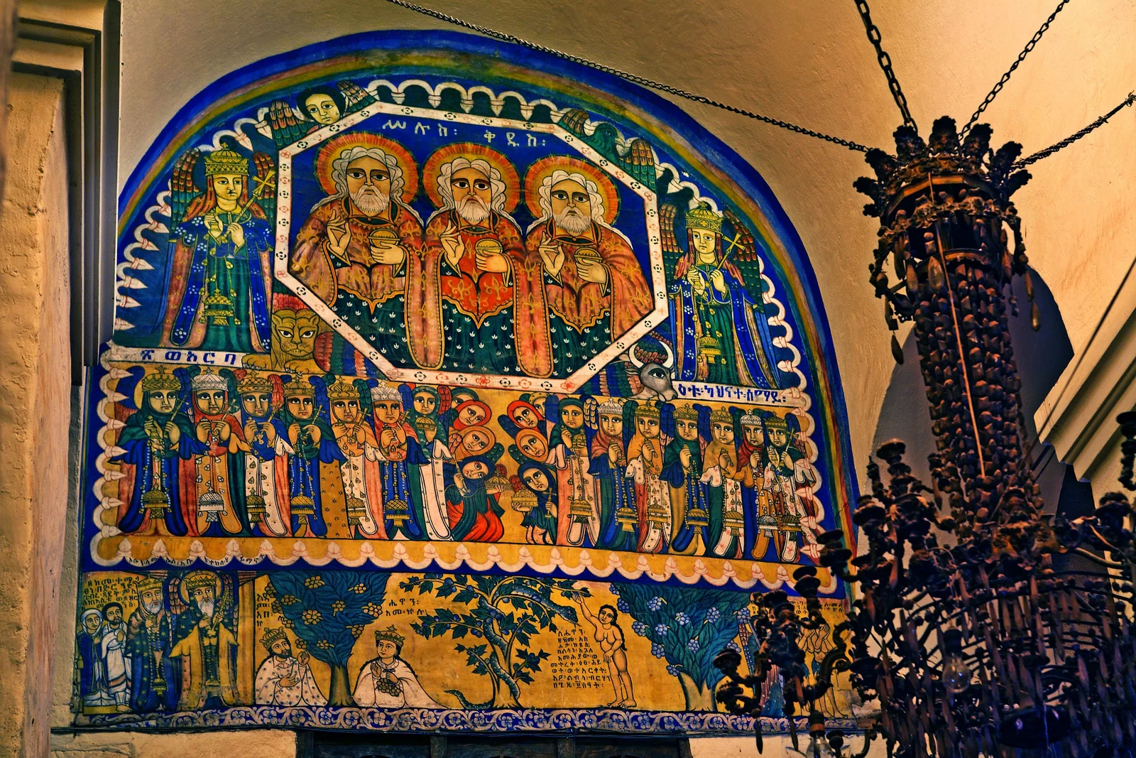 Traditional Paintings at the top of The Sanctuary Door. Source
