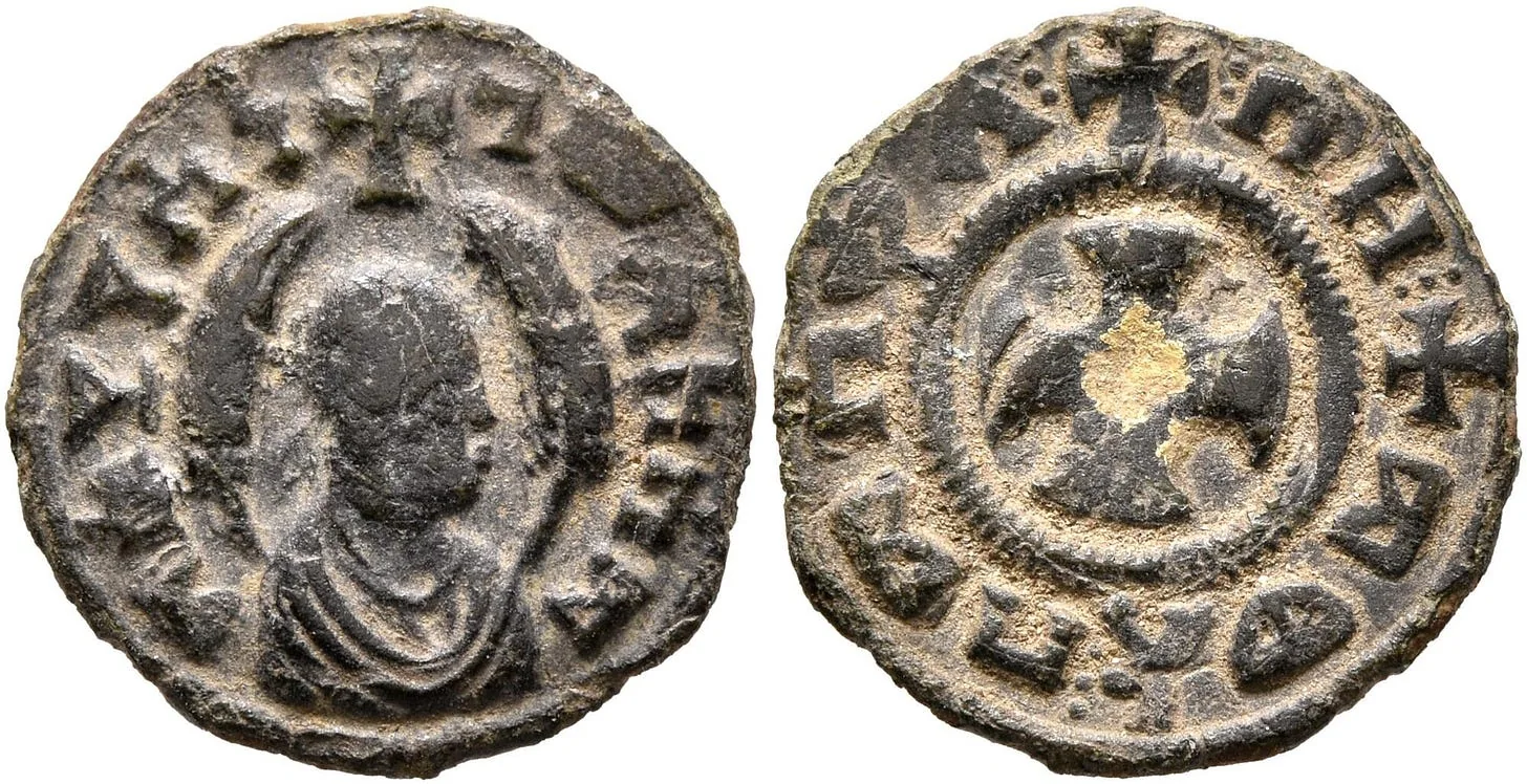 This bronze coin bears an inscription proclaiming "Mhdys, King of Aksum." On the reverse side, a message reads, "In this sign, you will conquer," accompanied by a cross." (Source)
