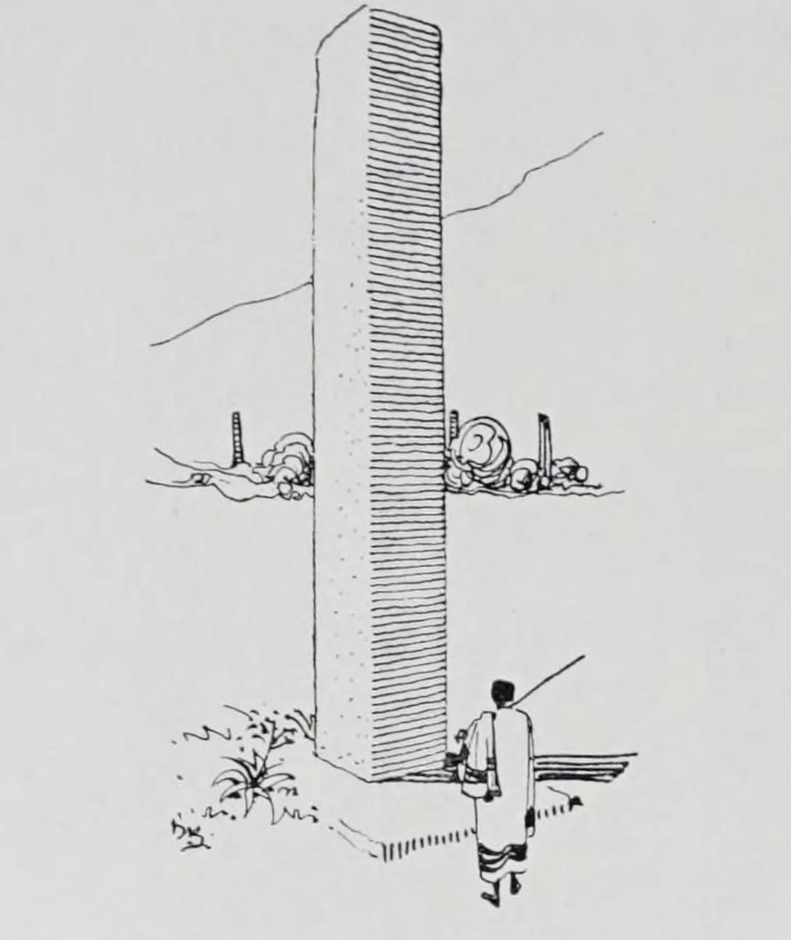 A man stands before a stele at Keskese. Source: Ältere Denkmäler Nordabessiniens, p. 144 (Fig. 301)
