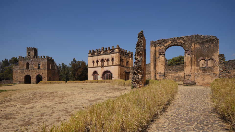 Stone towers and crenellated walls within Fasil Ghebbi at Gondar.