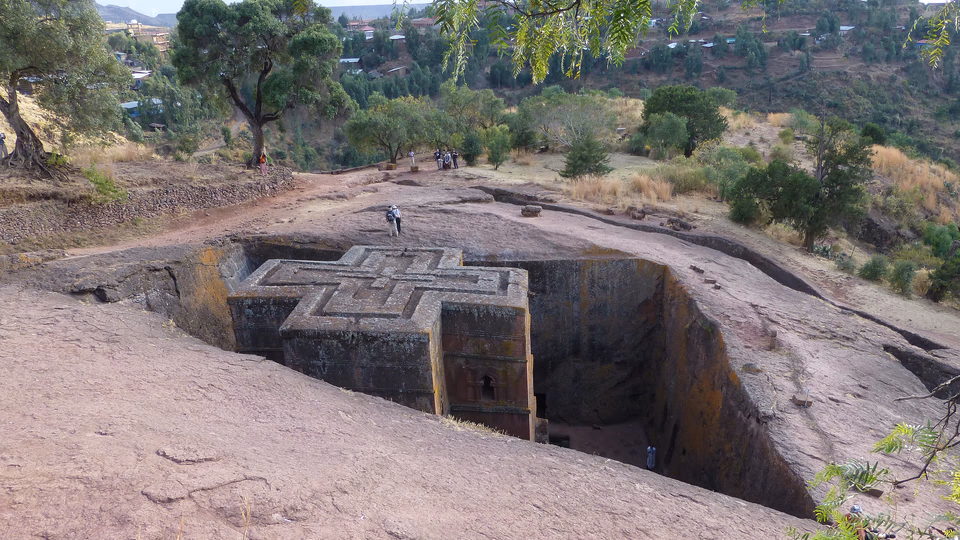 The cross-shaped roof of the rock-hewn church of Bete Giyorgis at Lalibela, cut down into red stone.