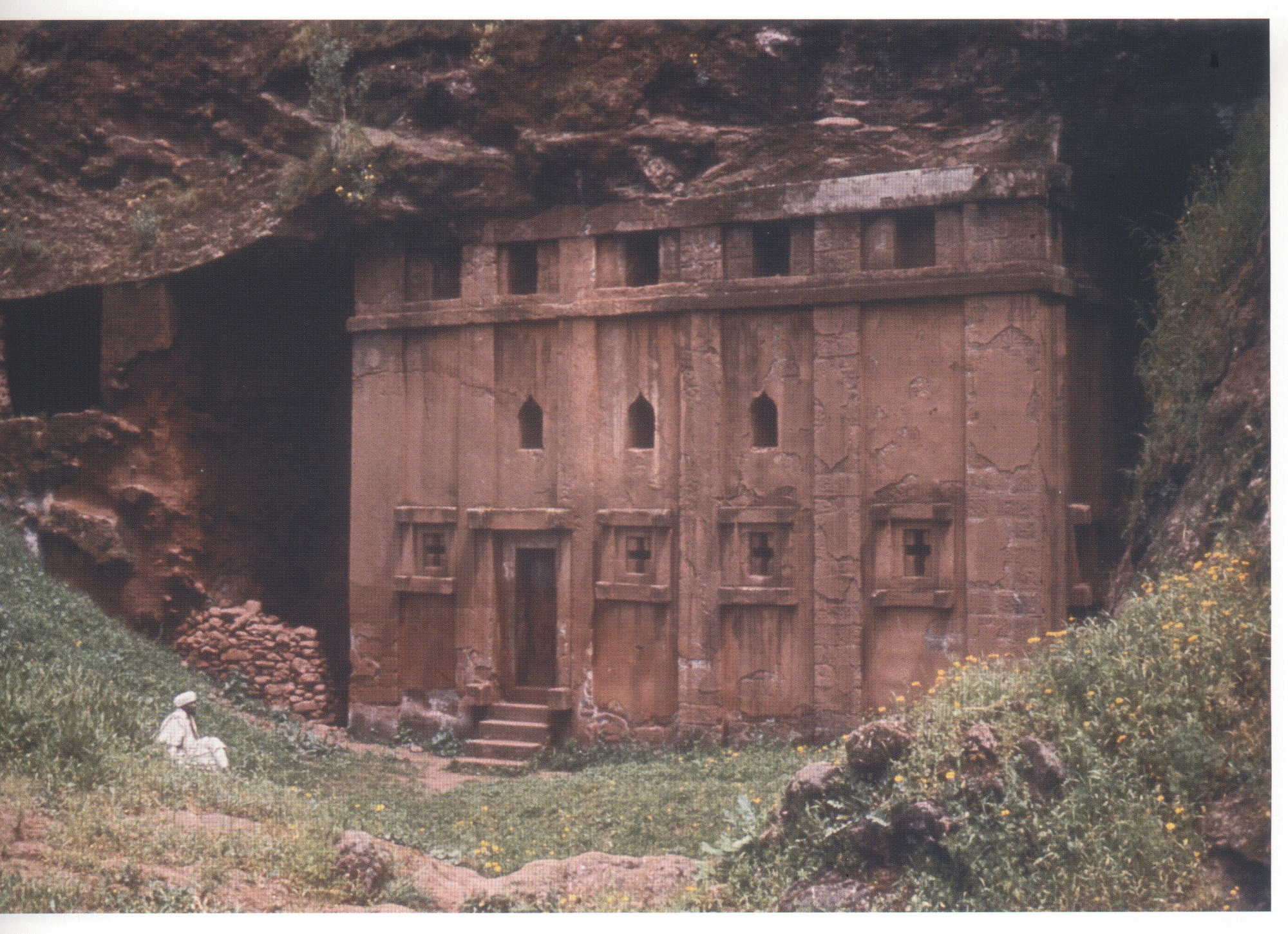 222 Beta Abba Libanos, view from the south, c. 1970. Since this photograph was taken, much accumulated silt has been removed from the floor of the court, and most of the vegetation shown here has been lost to erosion. Note reconstruction at east end.
