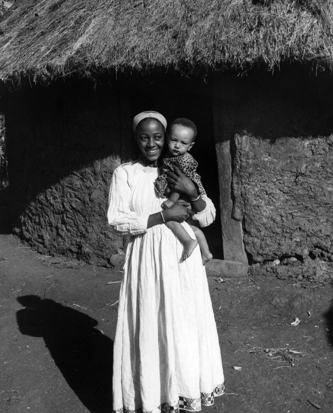 Mother and Child in Front of House