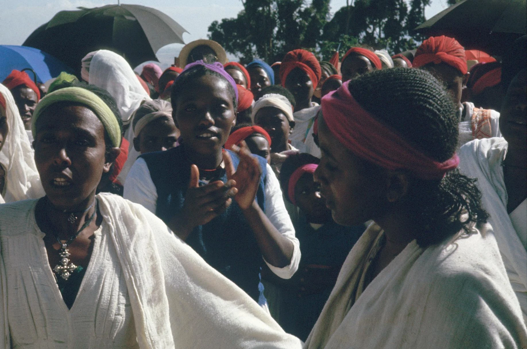 Possessed Woman Wearing Christian Cross and Appealing to the Spirits