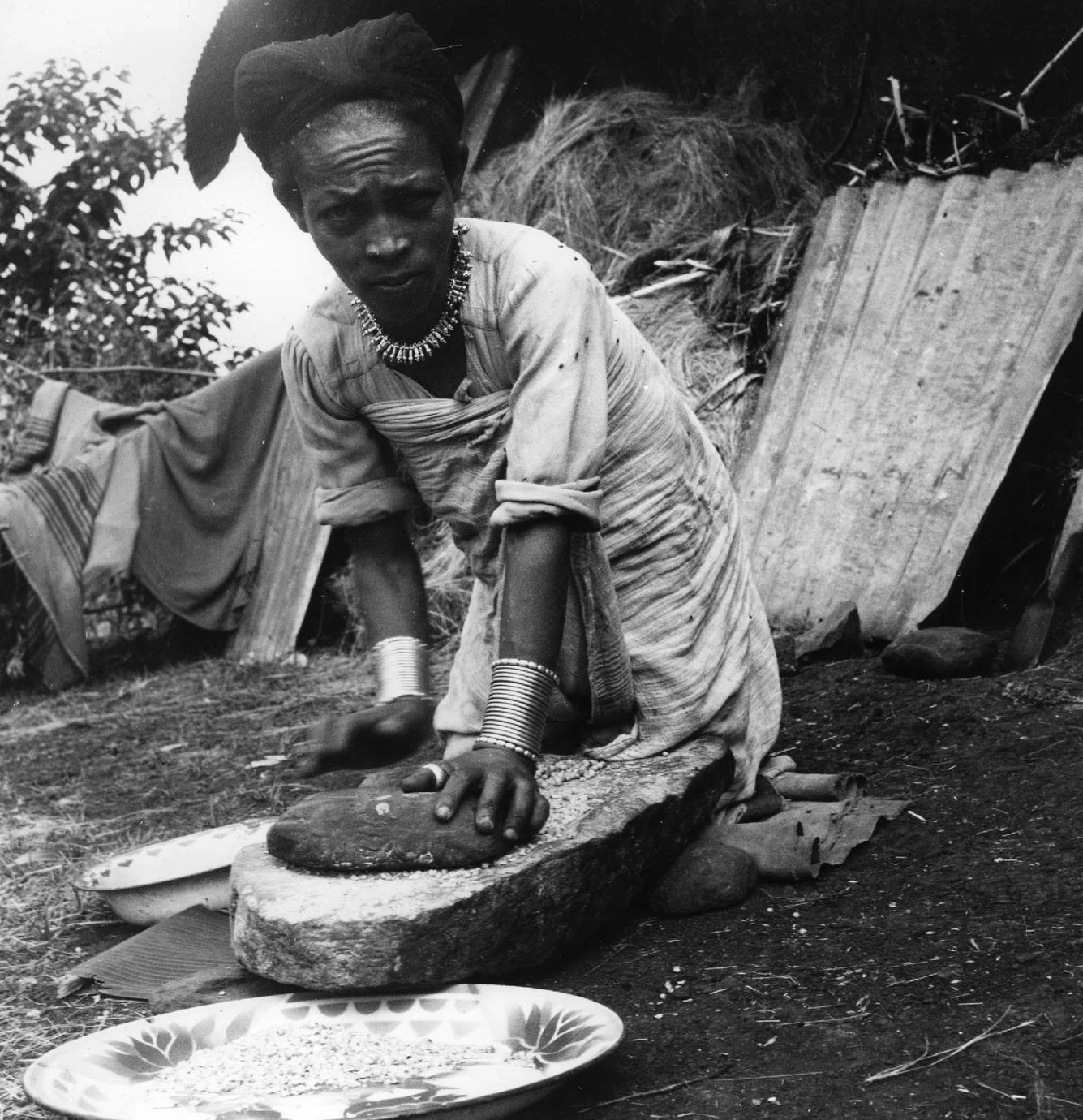 Woman Grinding Grain