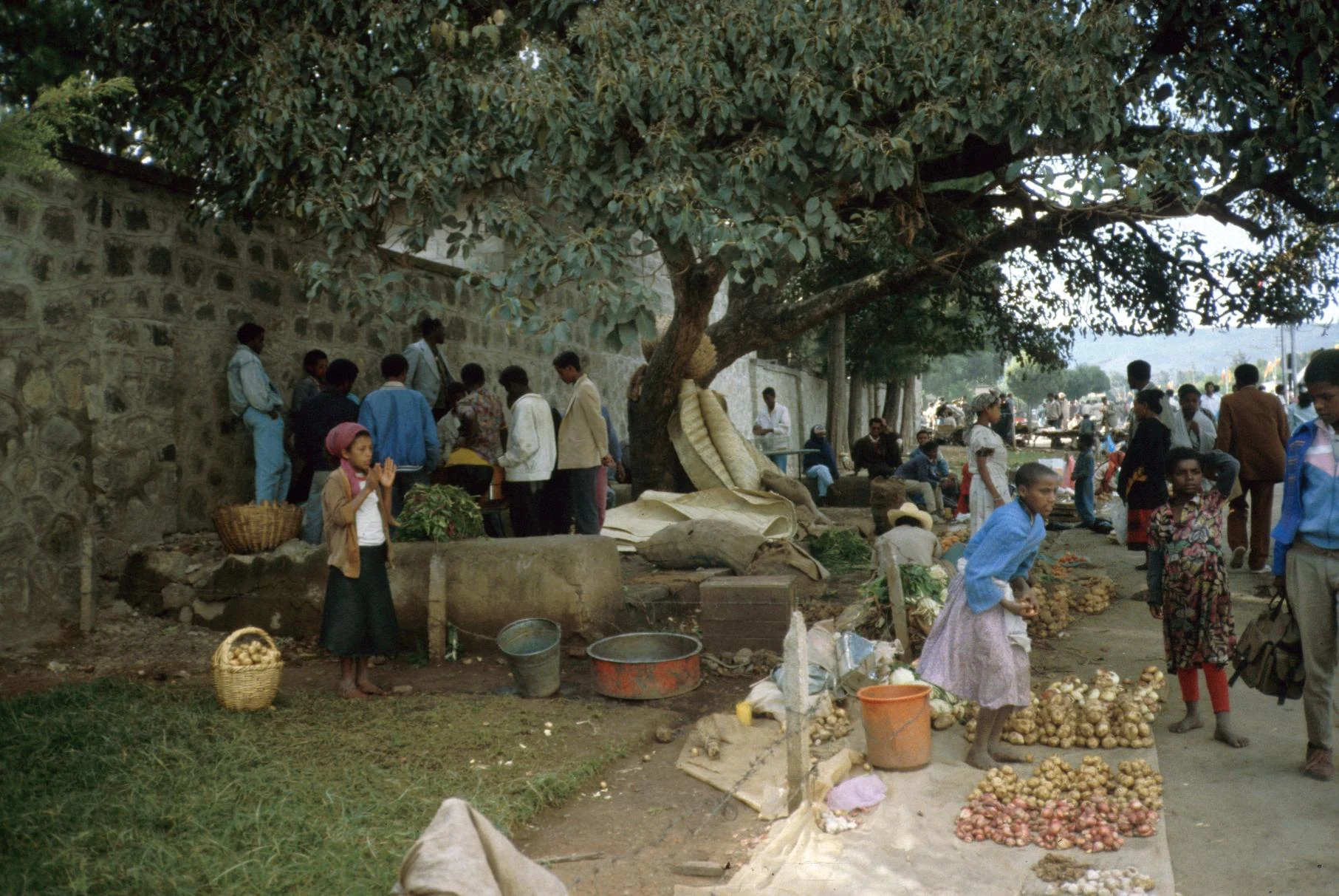 Sellers of Garlic and Potatoes Outside of Church