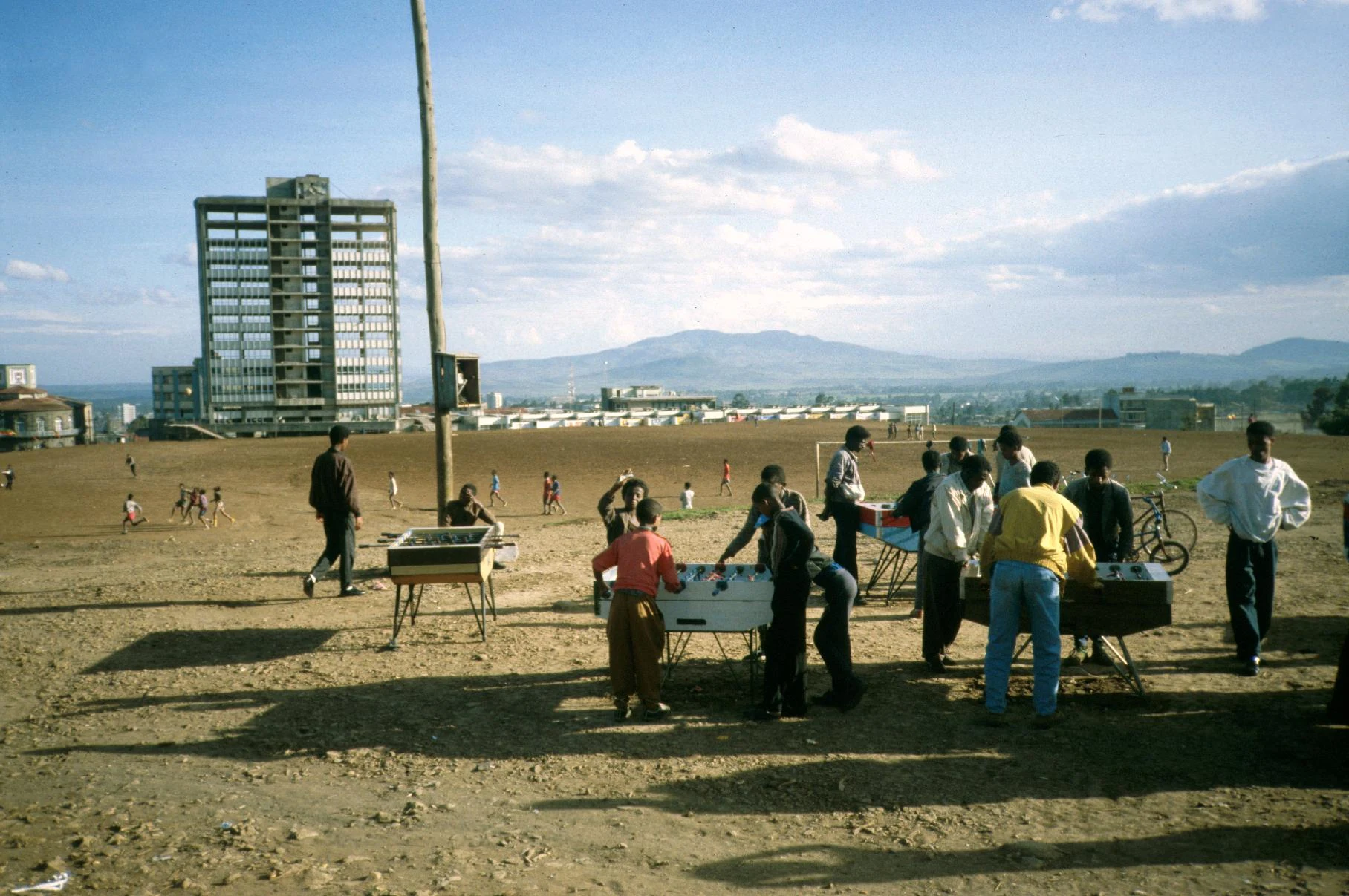 Foosball Players on Former Slum Area Cleared by the Derg