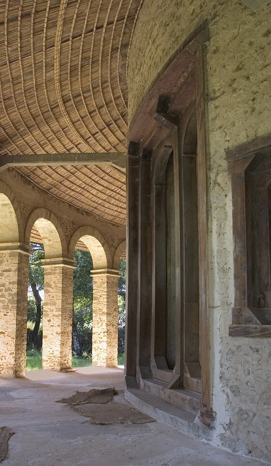 Under the arcade at Narga Selassie, with its arched openings and timber ceiling.