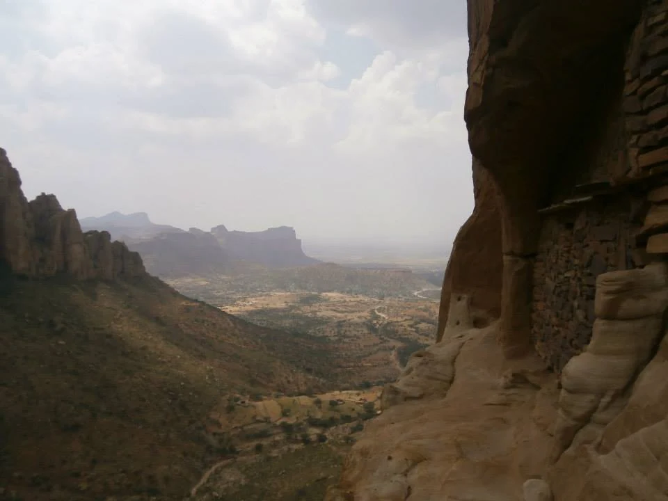 Abuna Yemata Guh: cliffside entrance and rock-cut doorway.