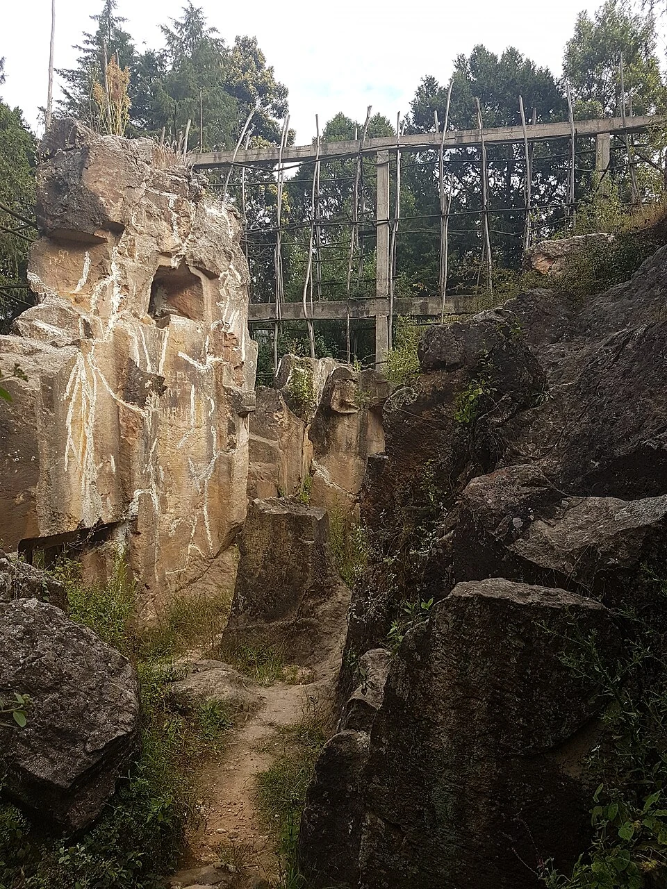 Washa Mikael: surviving rock-cut walls with scaffolding.