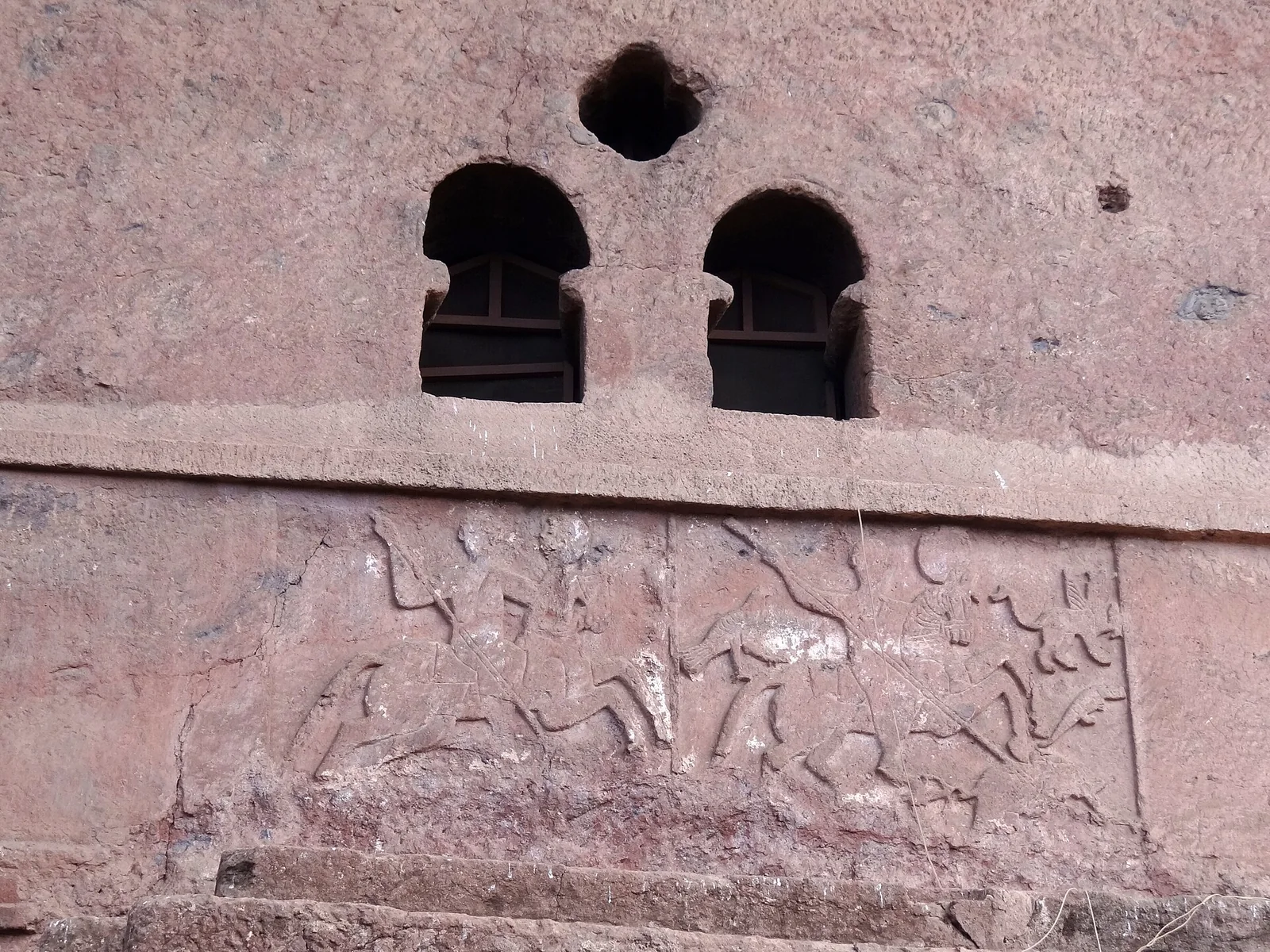 Facade of Bet Maryam Rock-Hewn Church Showing Riders Fighting a Dragon - Lalibela - Ethiopia