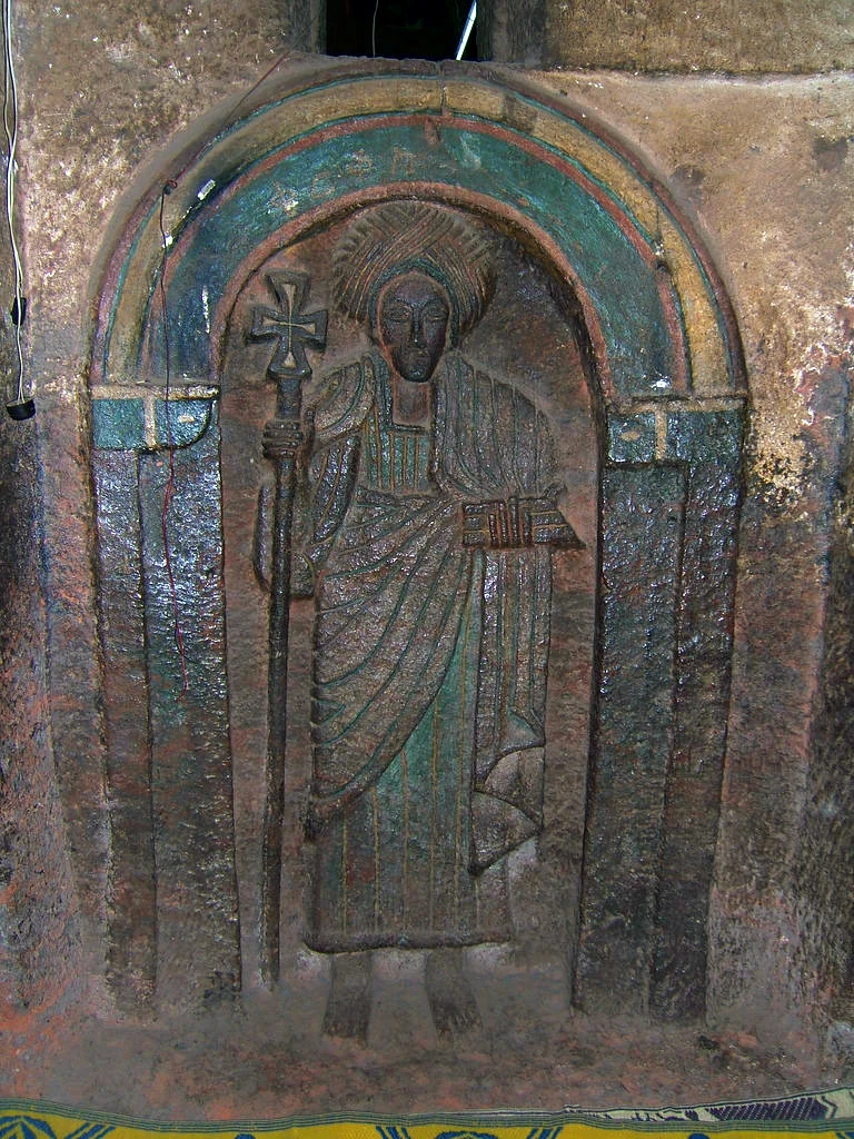 Biete Golgotha: carved saint relief in an arched niche.
