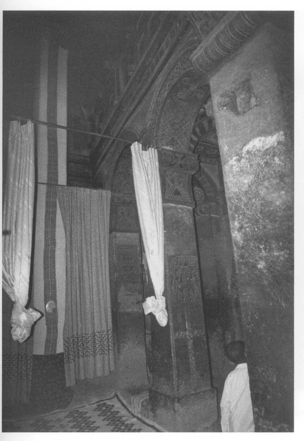 Beta Maryam, the nave, looking southeast, 1998. The cloth-shrouded pillar known as amda berhan is visible between the curtains on the left.