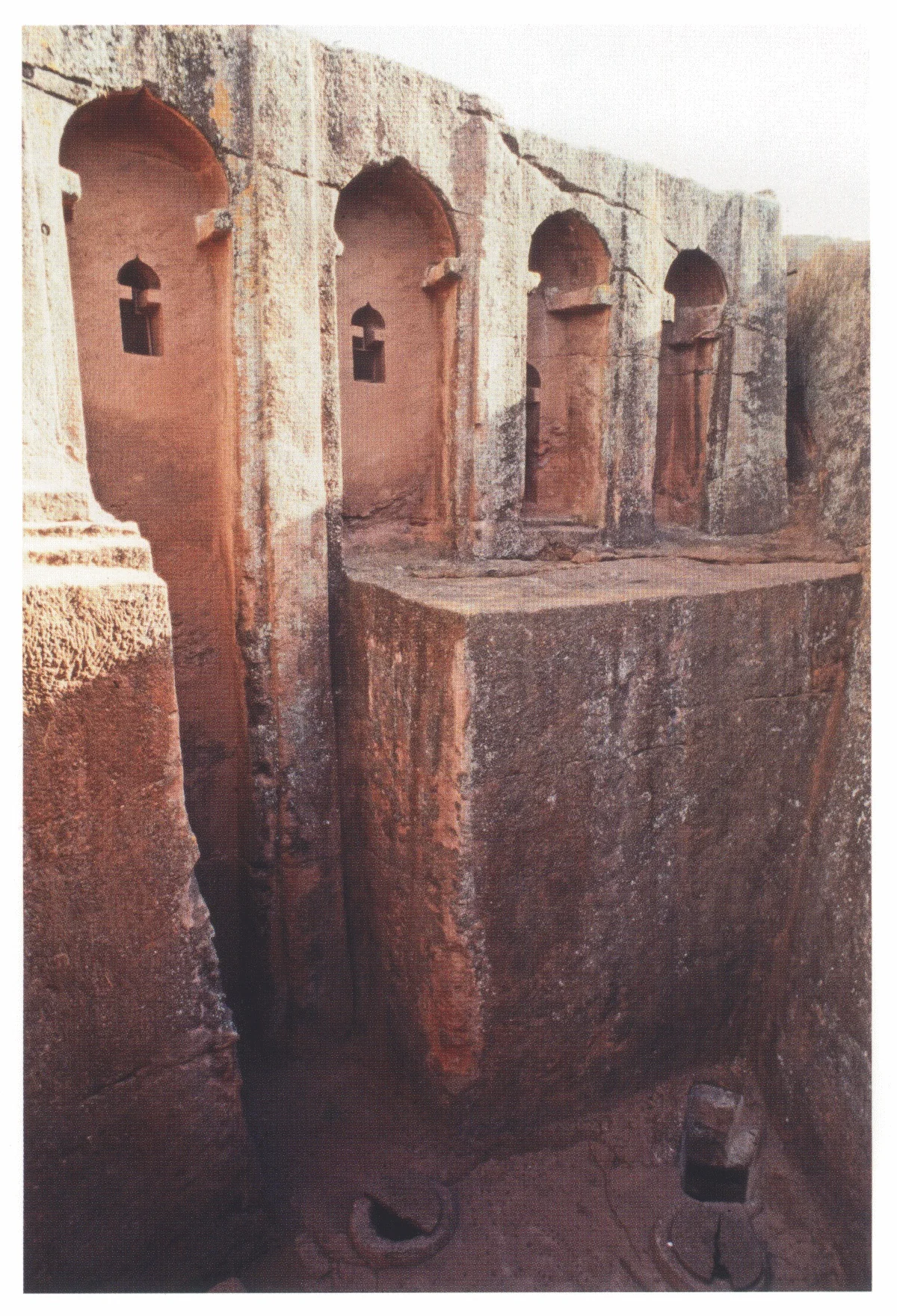 Beta Gabriel-Rafa’el, the deep triangular court, from the northwest, 2006. Clearly visible are the western part of the principal 17-m-high façade and the platform outside the original door of Beta Rafa’el. Two of the shafts leading to the cistern are set in the floor.