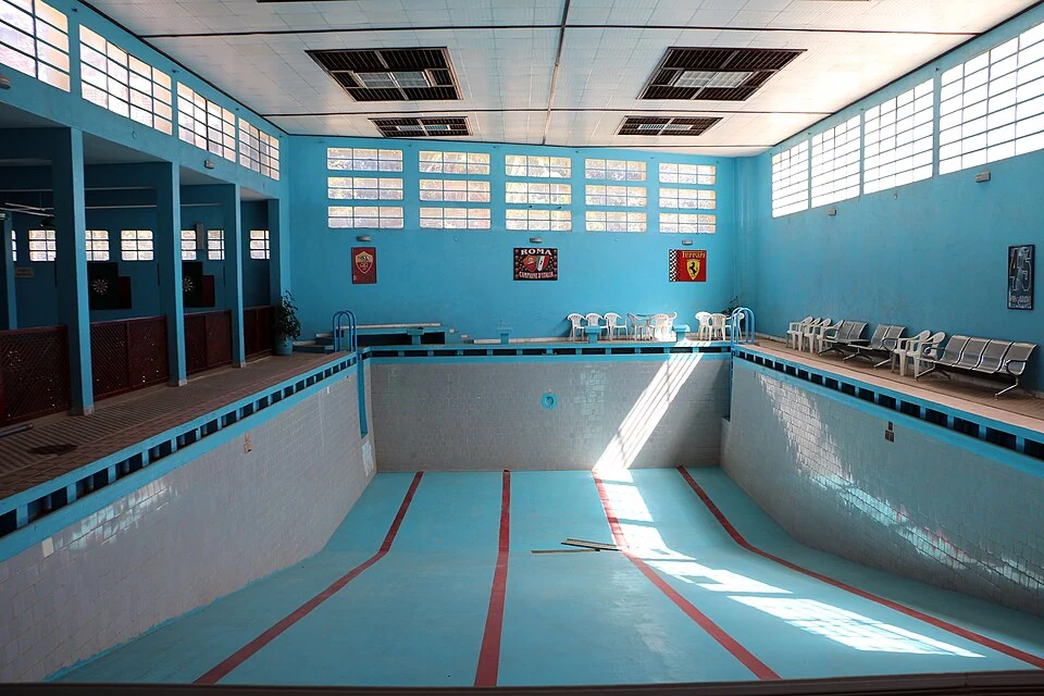 Municipal Swimming Pool, Asmara: empty basin and glazed upper walls.