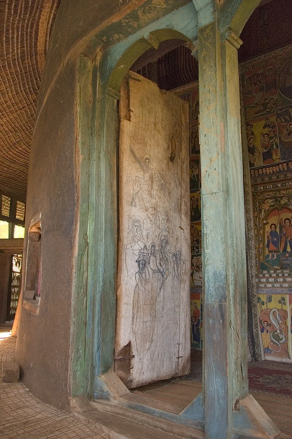 Ura Kidane Mehret: timber entrance doorway and painted wall.