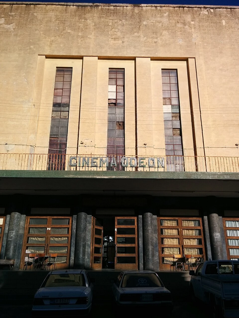 The upper facade and entrance of Cinema Odeon, Asmara.