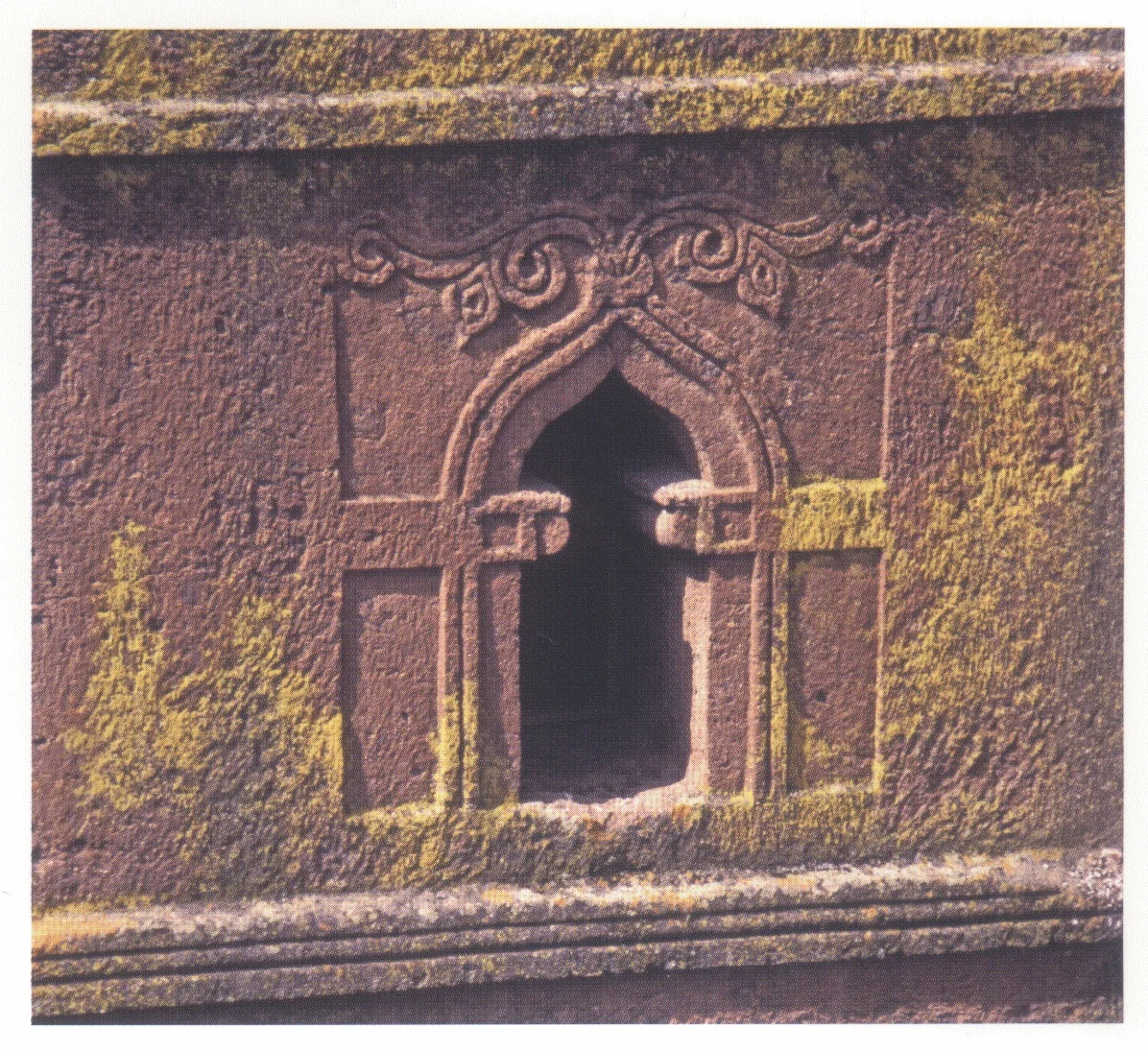 Beta Giyorgis, one of the steleform upper windows with arabesque decoration of vine tendrils and a cross, 1997.