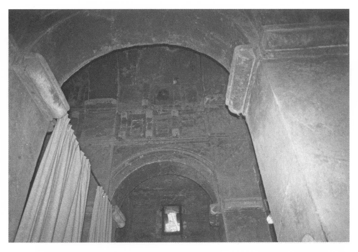 Beta Emmanuel, the eastern bay of the nave, showing the Aksumite frieze, 1998. The curtains on the left hide the sanctuary.