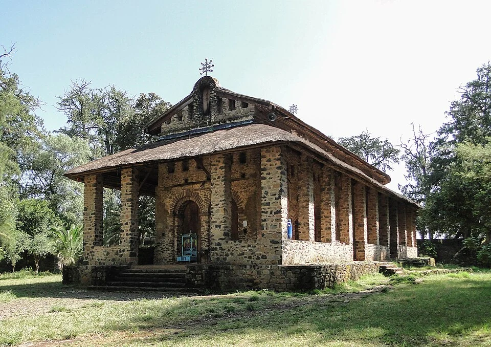 Debre Berhan Selassie: stone church and columned verandah.