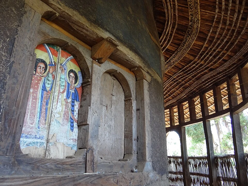 Painted wall, carved recesses and timber gallery at Ura Kidane Mehret.