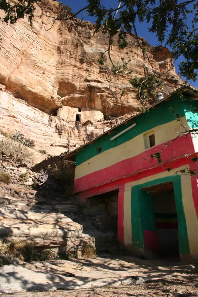 Mika'el Debra Selam: colour exterior of the painted entry block under the cave overhang.